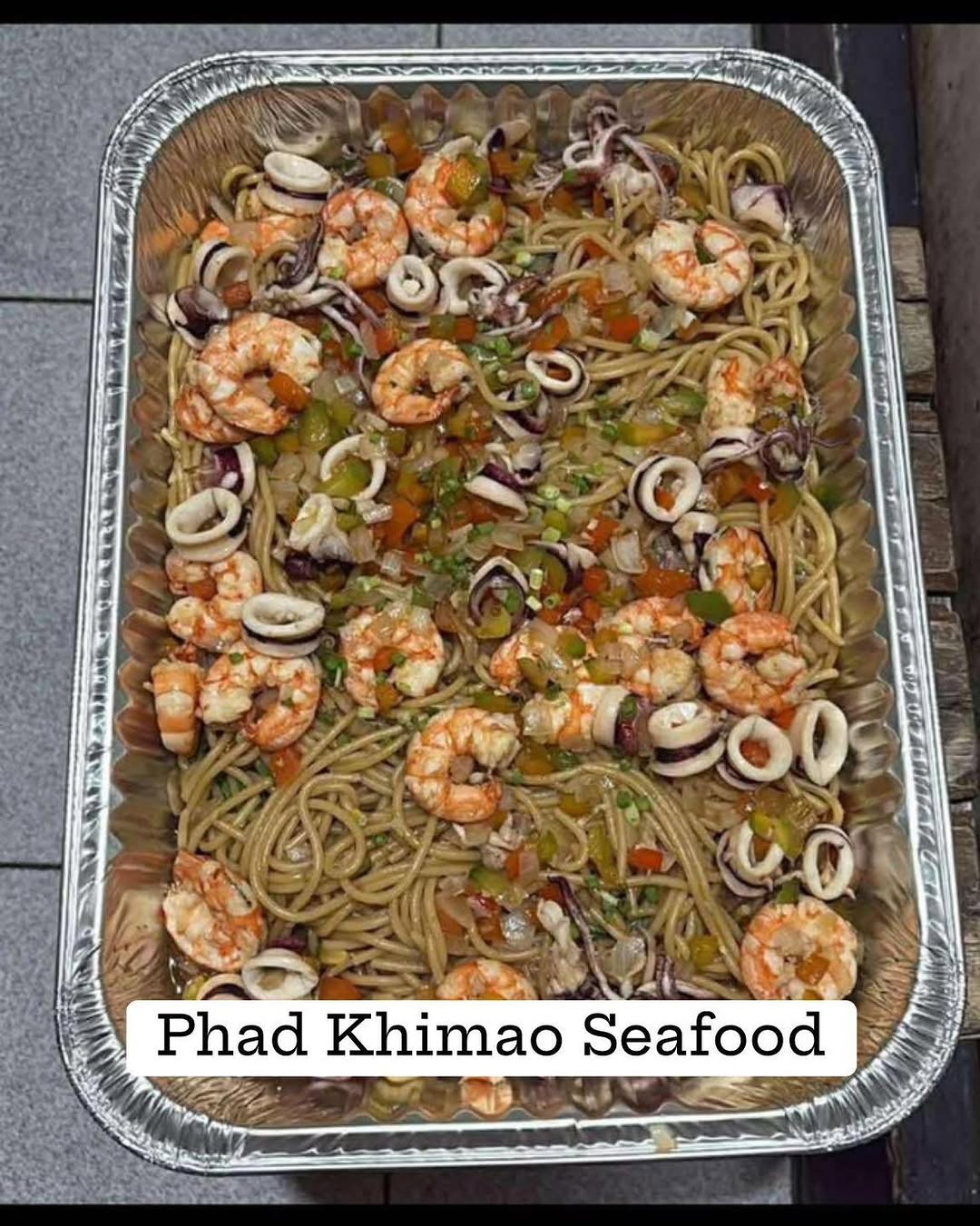 Multiple party tray orders lined up for delivery — busy day at Phad Thai Pacita