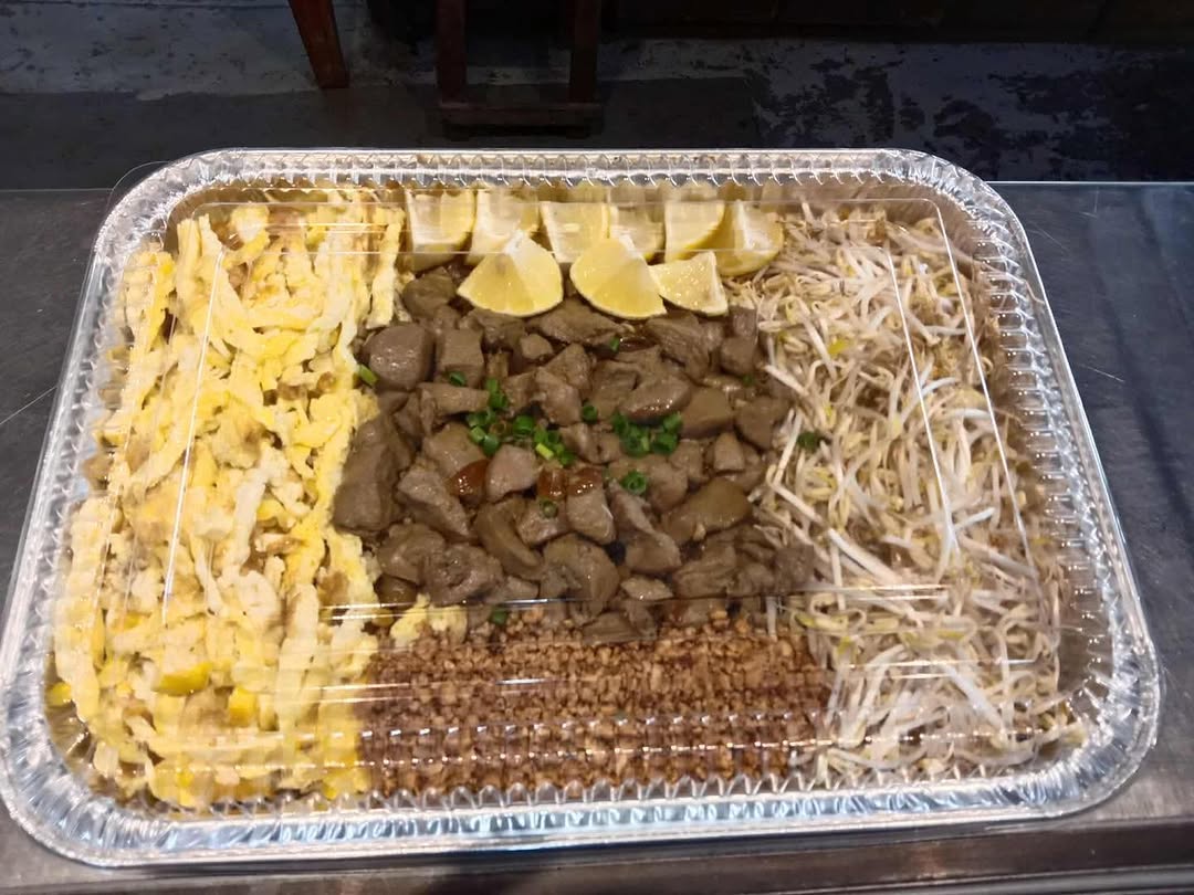 Phad Thai Pacita kitchen counter with stainless equipment and food preparation area